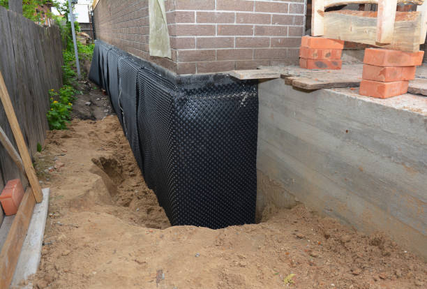 Happy homeowners after waterproofing job in Faunsdale